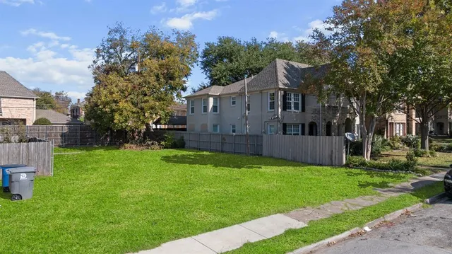 an aerial view of a house with a yard basket ball court and outdoor seating