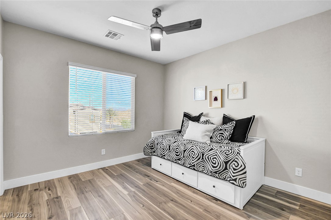 9688 Rankin Rdg Court Las Vegas, NV 89178 - Photo 30 of 53 Hardwood floors and a ceiling fan enhance the comfort of this inviting bedroom.