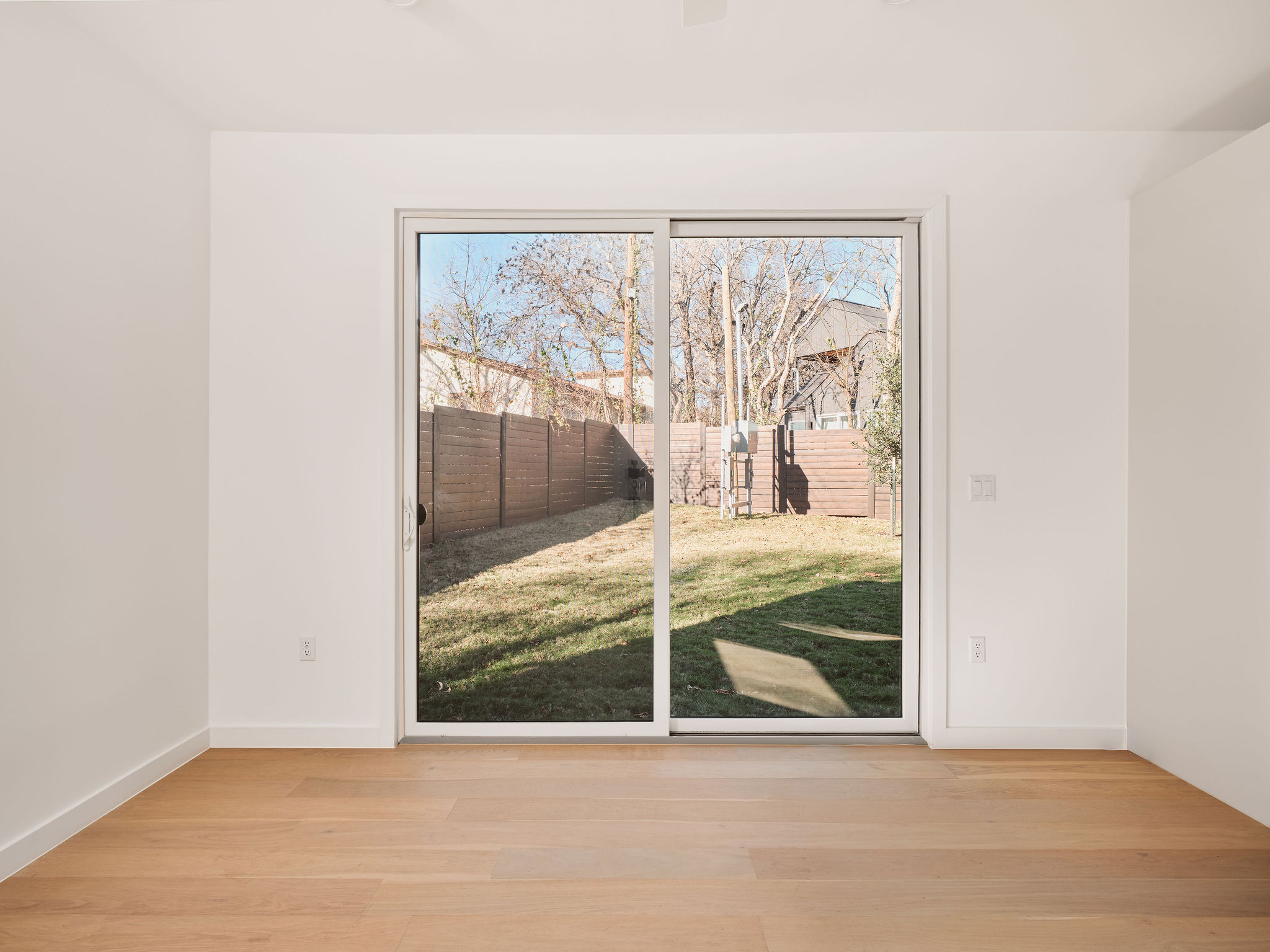 3209 Dolphin Drive, Unit 2 Austin, TX 78704 - Photo 12 of 28 Doorway featuring wood finished floors