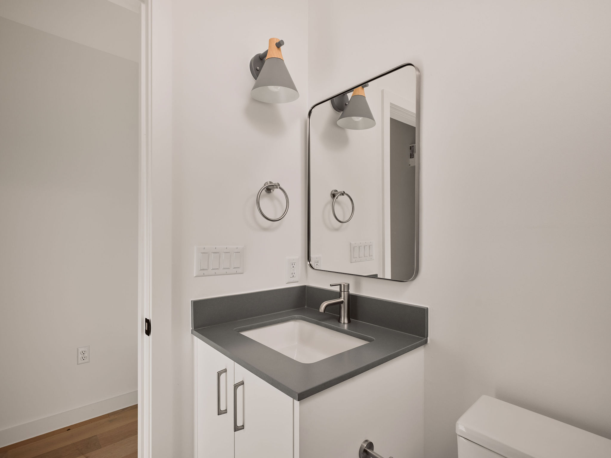 3209 Dolphin Drive, Unit 2 Austin, TX 78704 - Photo 23 of 28 Bathroom with vanity and wood finished floors