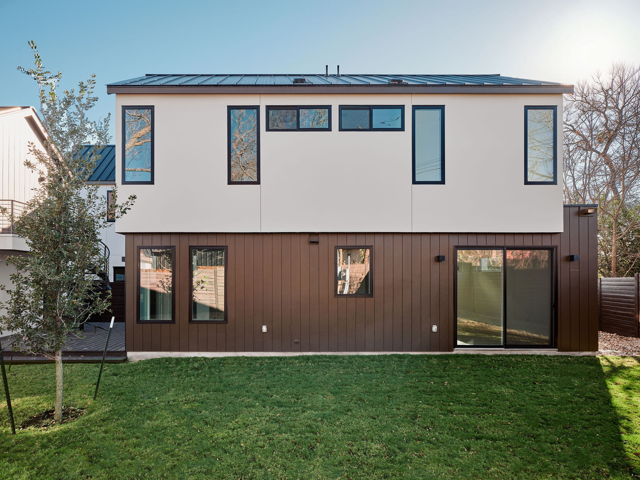 3209 Dolphin Drive, Unit 2 Austin, TX 78704 - Photo 25 of 28 Rear view of house with a yard, a metal roof, and a deck