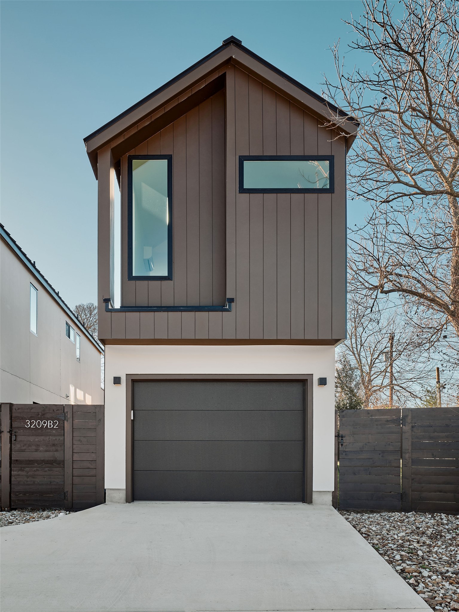 3209 Dolphin Drive, Unit 2 Austin, TX 78704 - Photo 3 of 28 View of front of house with a garage and concrete driveway