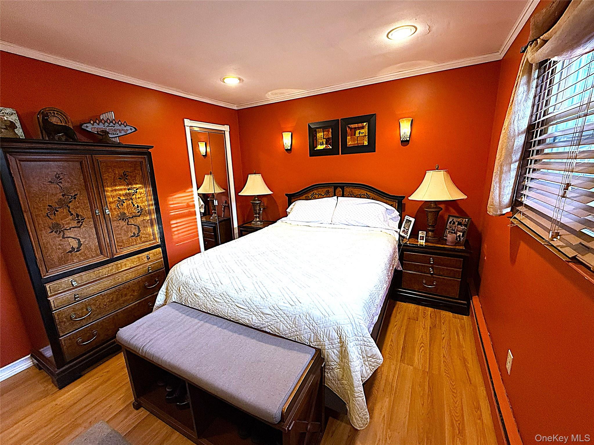1 Heston Road Shirley, NY 11967 - Photo 20 of 32 Room featuring wood-finish flooring, recessed ceiling lighting, and crown molding