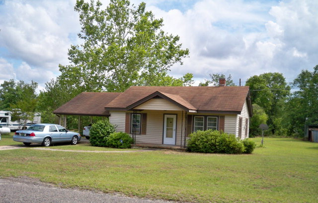 163 Bogeyville Road Ridge Spring, SC 29129 - Photo 1 of 1 a front view of a house with a garden