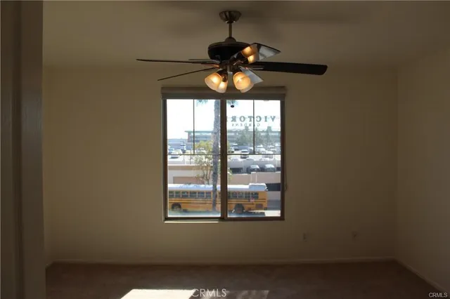a table and window in an empty room