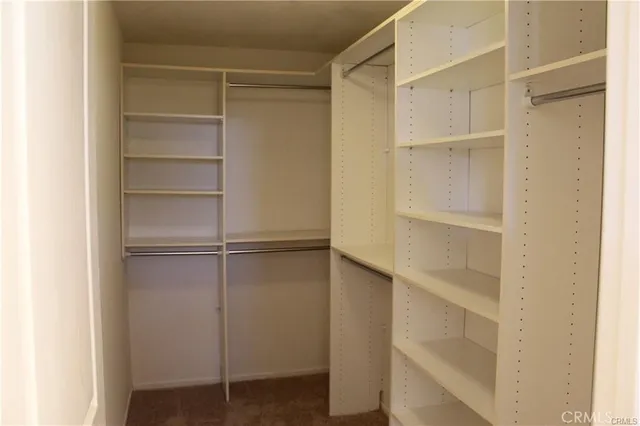 a view of a wooden deck with chairs and a yard