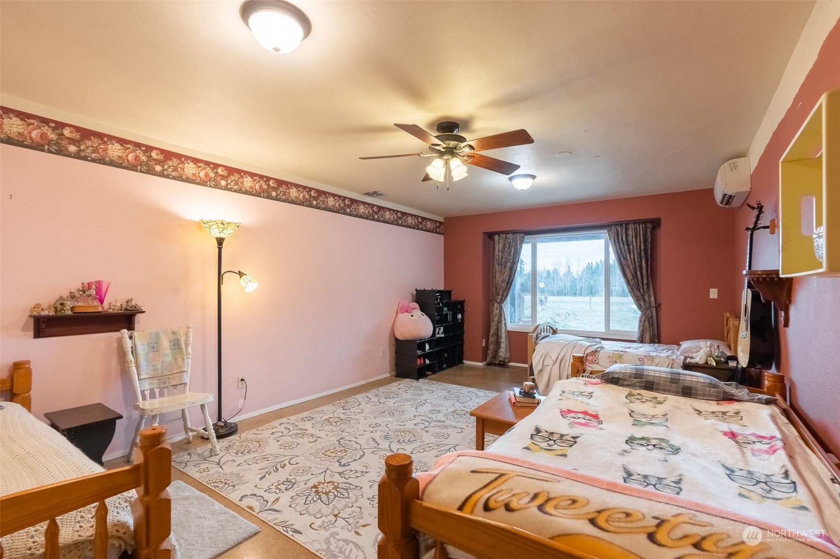 3020 Unick Road Ferndale, WA 98248 - Photo 23 of 40 a bed room with a bed and a chandelier
