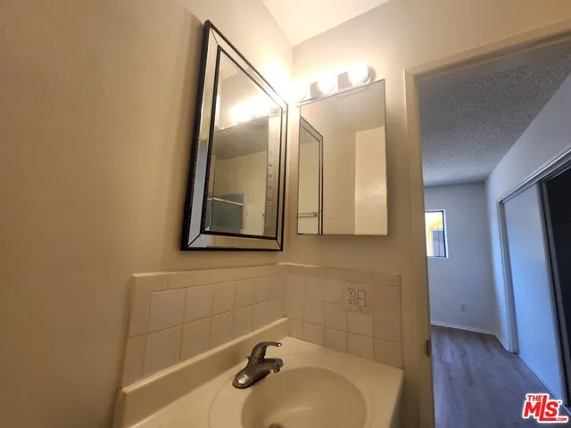 a bathroom with a sink and mirror