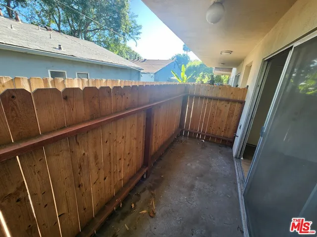 a view of balcony with wooden floor
