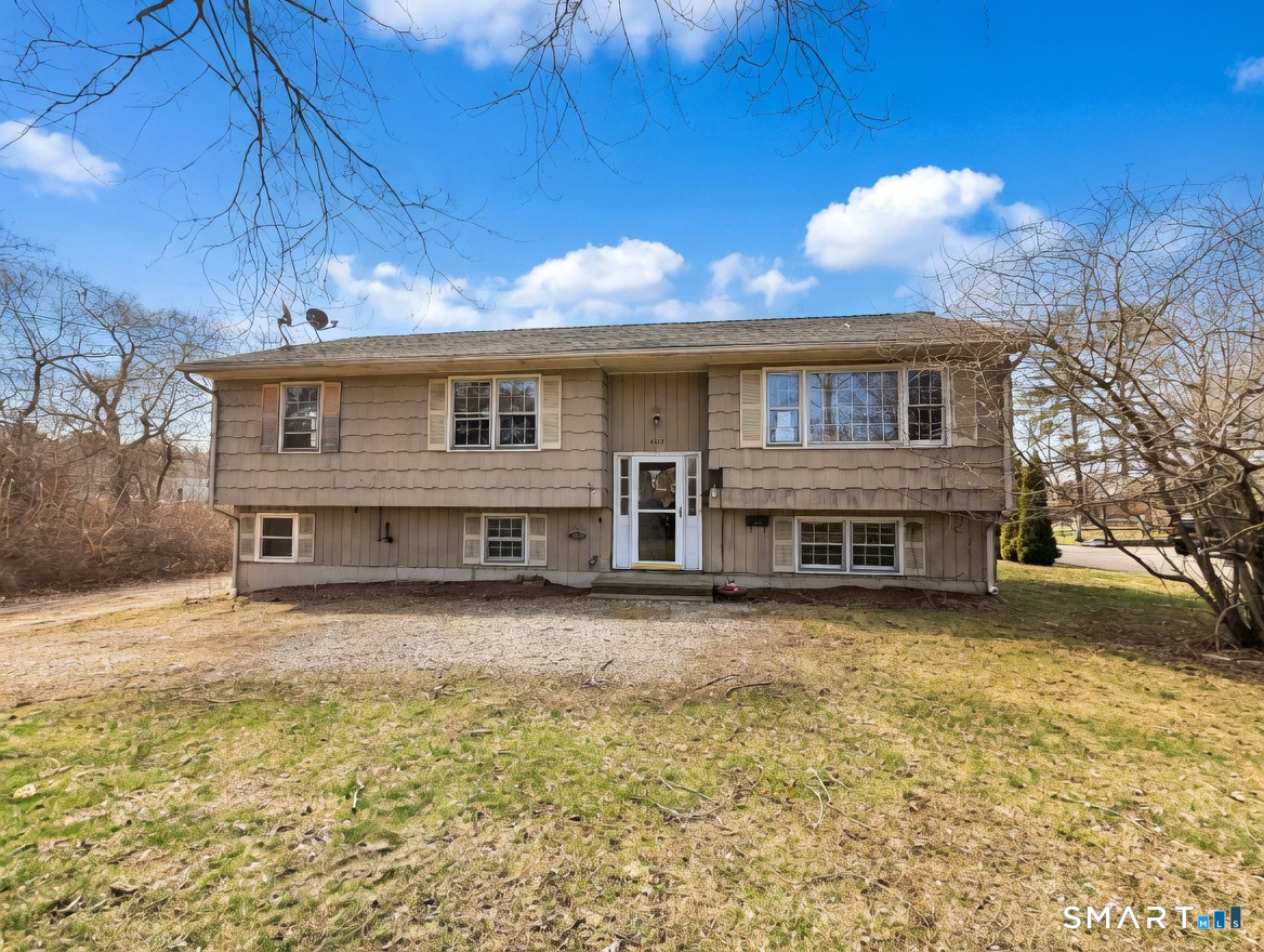 409 Boston Street Guilford, CT 06437 - Photo 1 of 28 a front view of a house with a yard