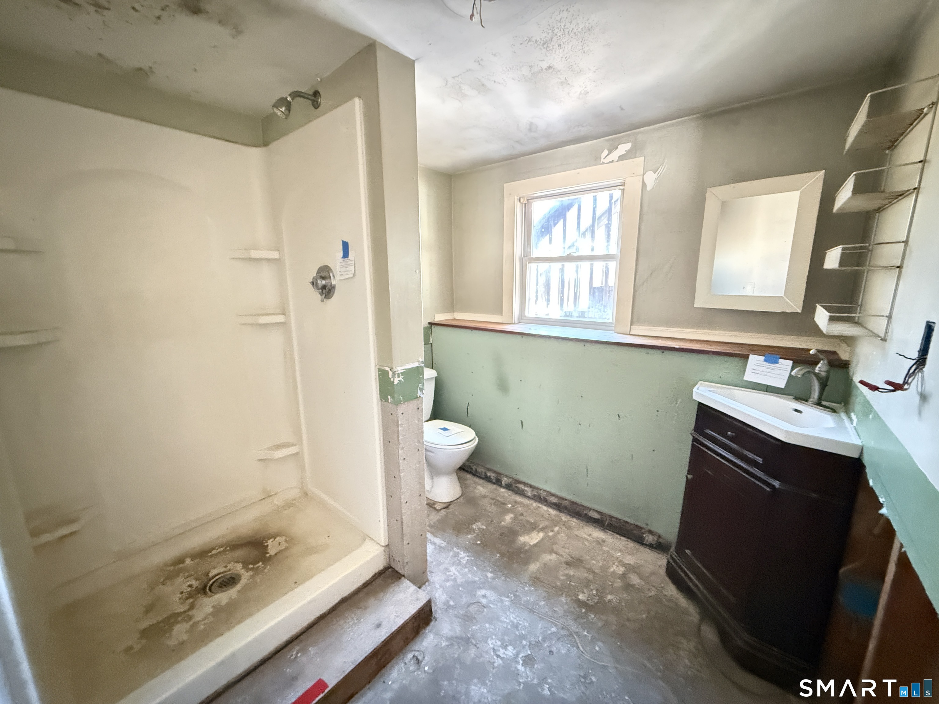 409 Boston Street Guilford, CT 06437 - Photo 23 of 28 a bathroom with a sink toilet and shower
