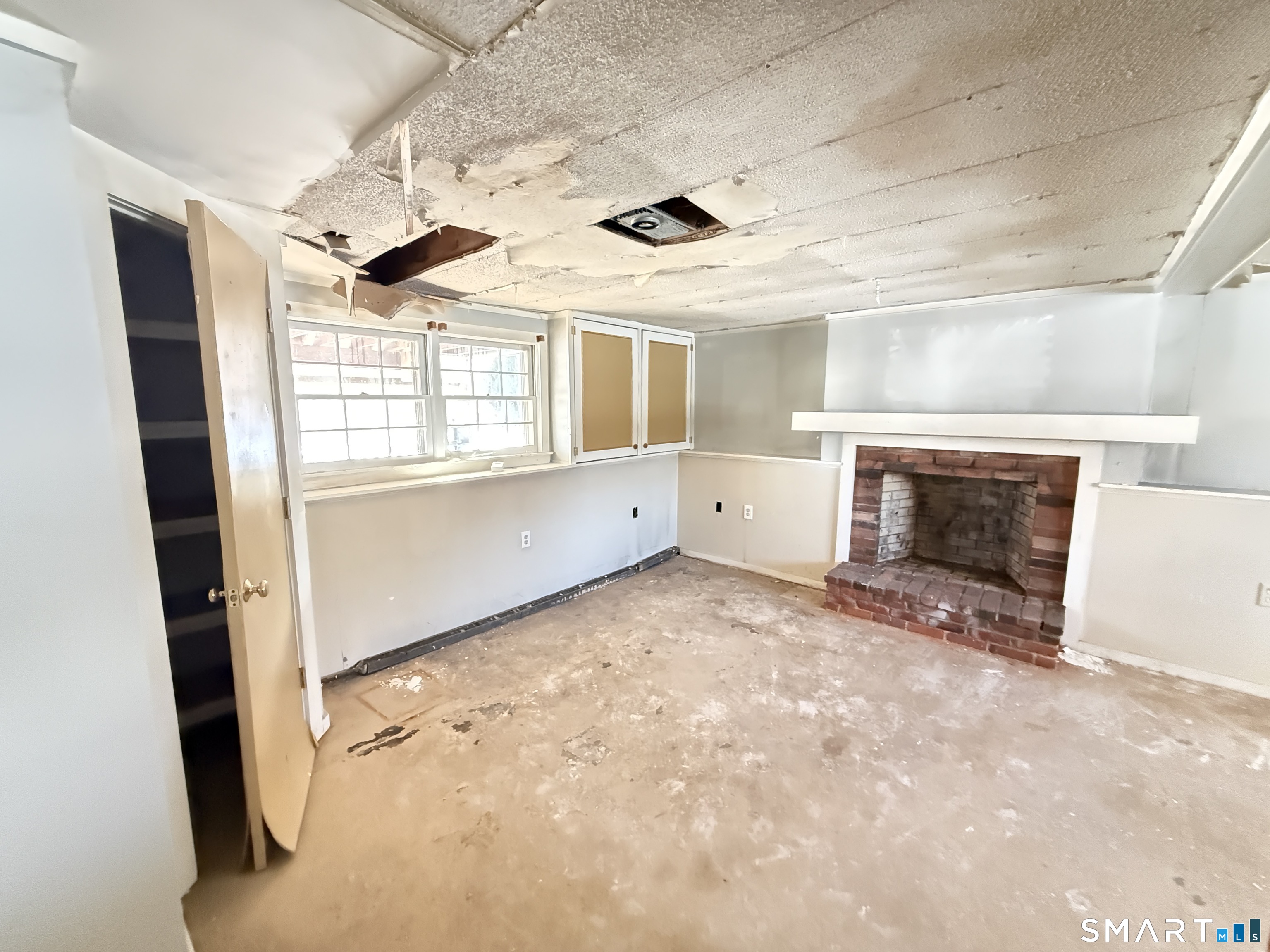 409 Boston Street Guilford, CT 06437 - Photo 24 of 28 wooden floor in an empty room with a fireplace