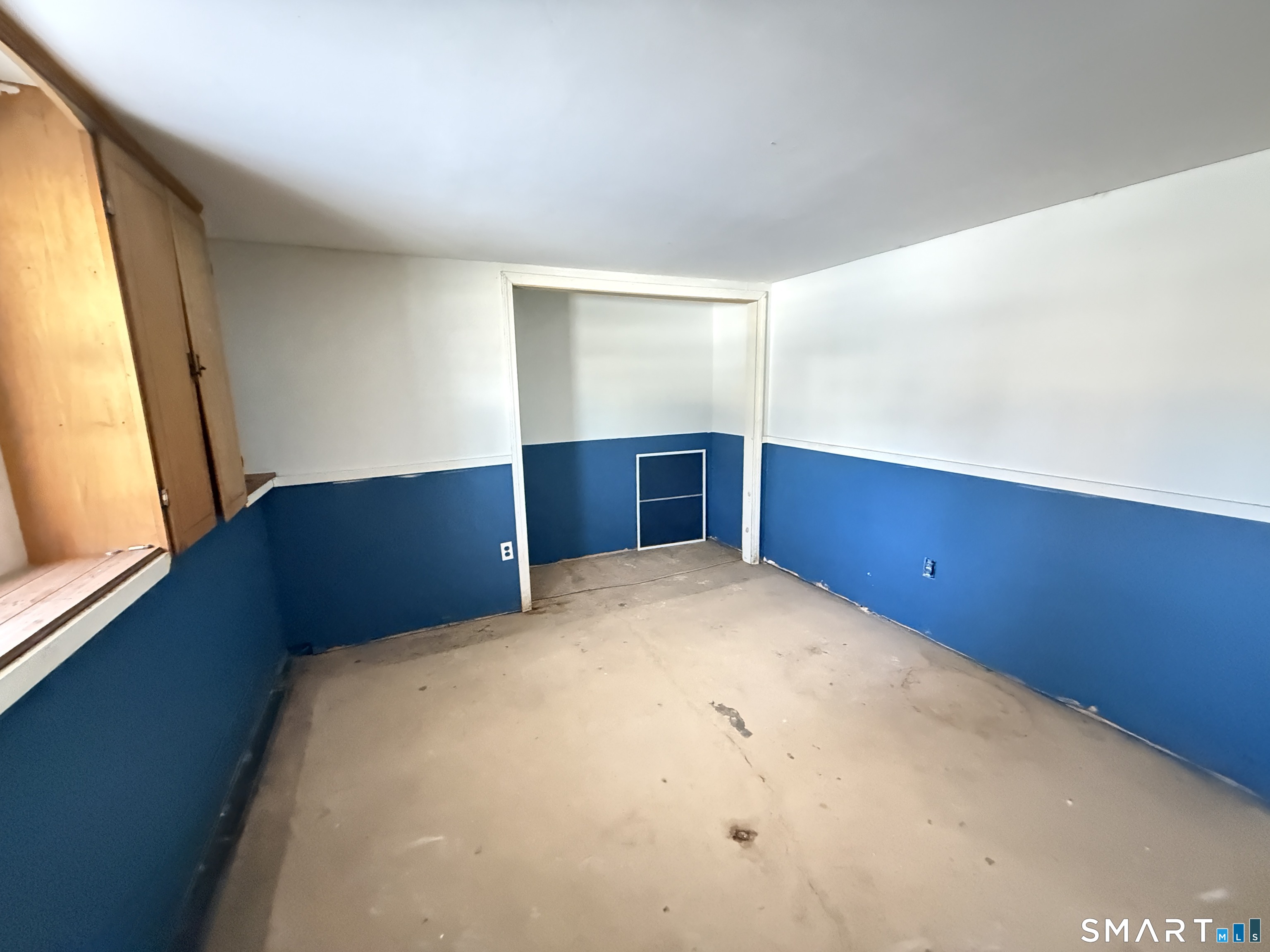 409 Boston Street Guilford, CT 06437 - Photo 26 of 28 a view of a room with cabinet and mirror