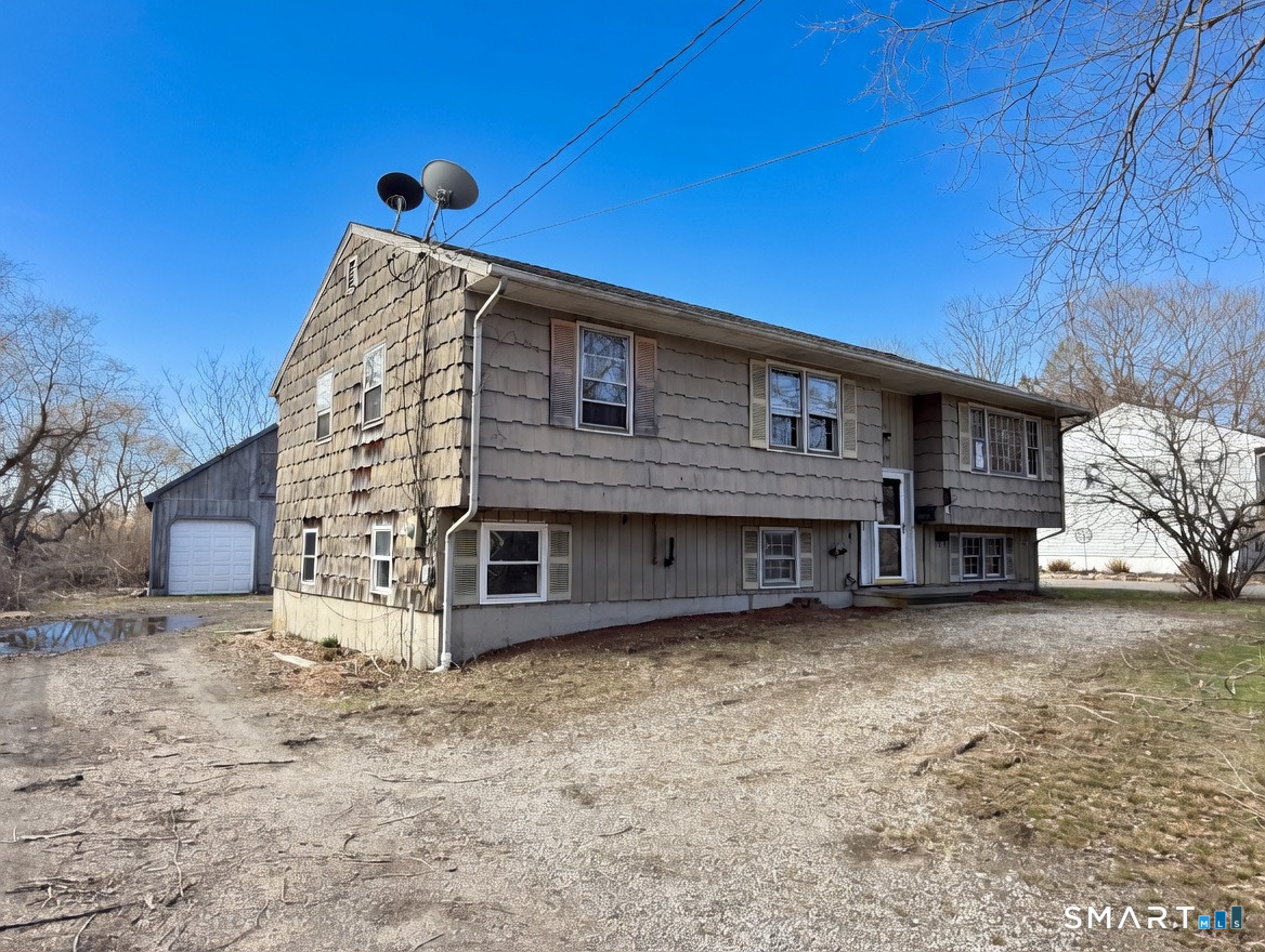 409 Boston Street Guilford, CT 06437 - Photo 3 of 28 a front view of a house with a yard