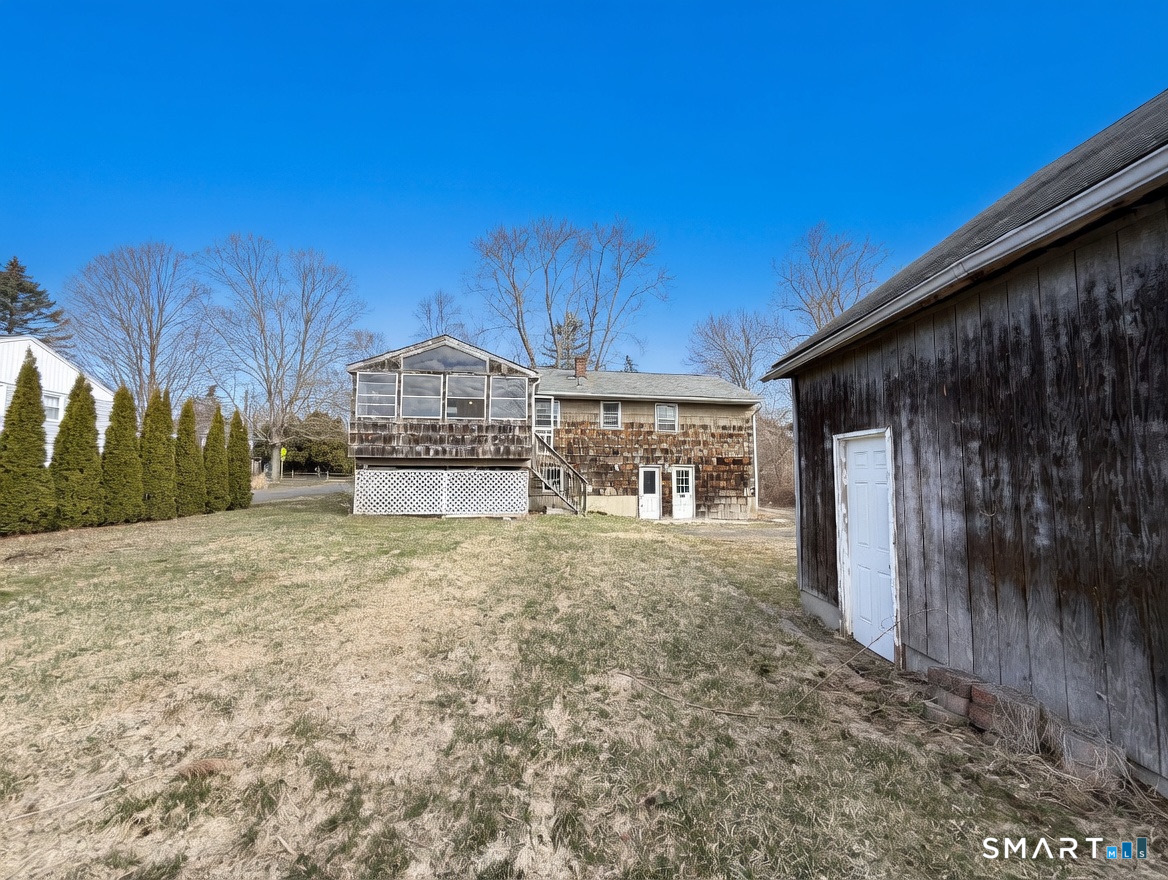 409 Boston Street Guilford, CT 06437 - Photo 7 of 28 a view of a house with a yard