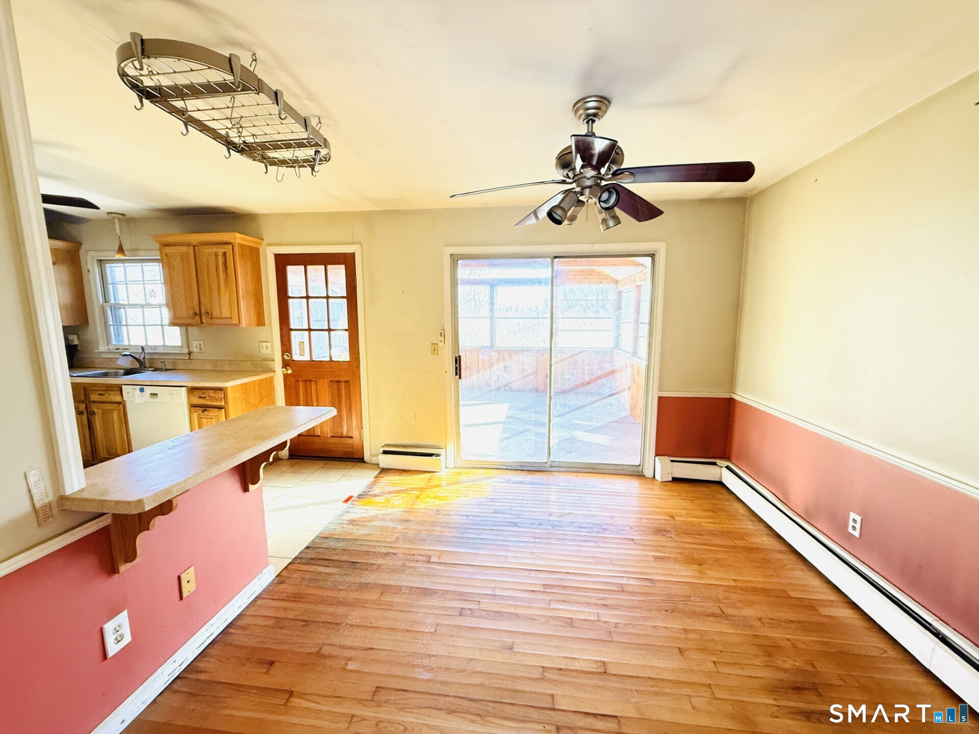 409 Boston Street Guilford, CT 06437 - Photo 10 of 28 a view of a room with wooden floor and windows