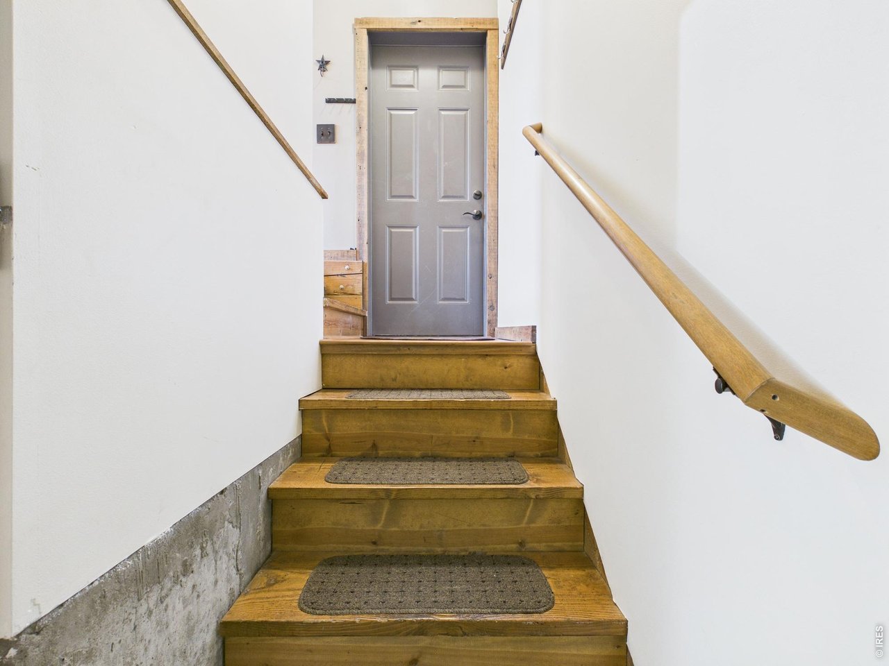 131 West Boulder Street Nederland, CO 80466 - Photo 19 of 46 Stairs to the first floor from basement area, Garage entry door.