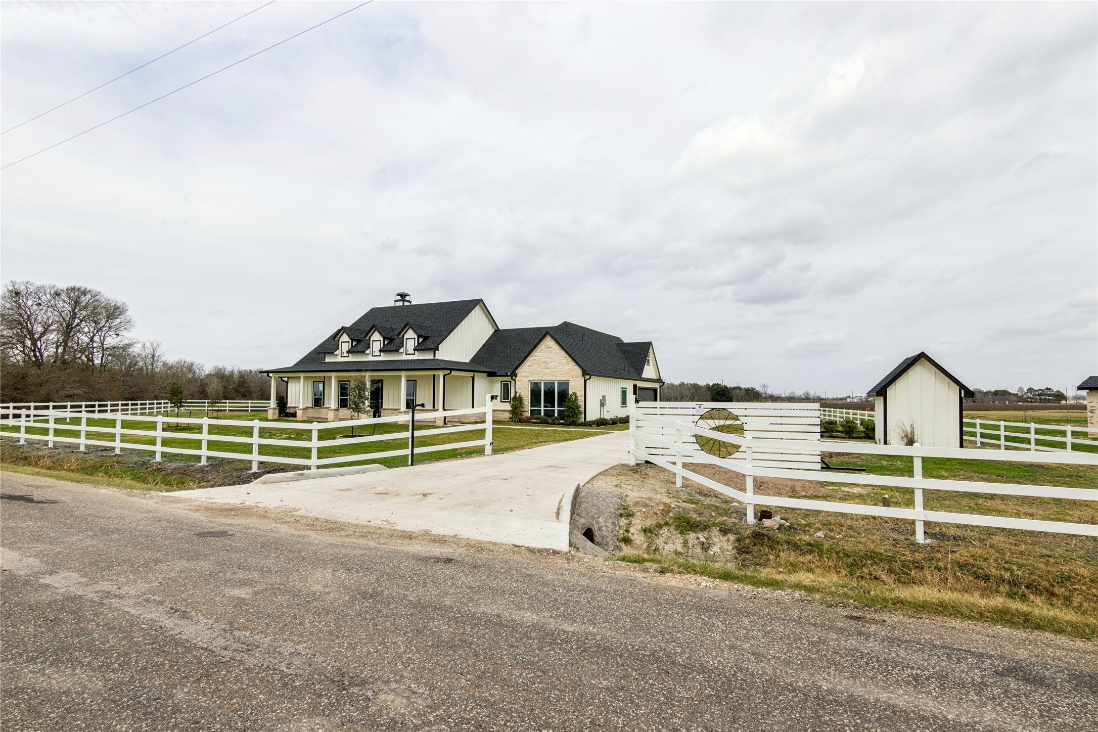 5766 Ward Bend Road Sealy, TX 77474 - Photo 4 of 45 a house with trees in front of it