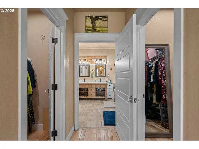 a bathroom with a tub sink and mirror