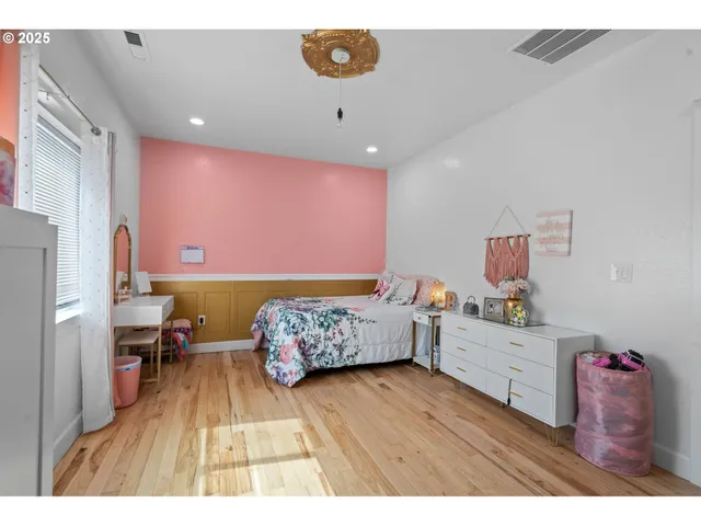 a bedroom with furniture and a window