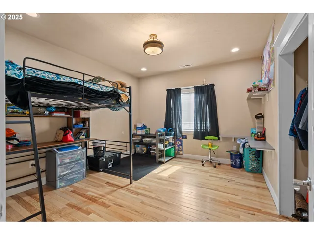 a living room with lots of furniture and wooden floor