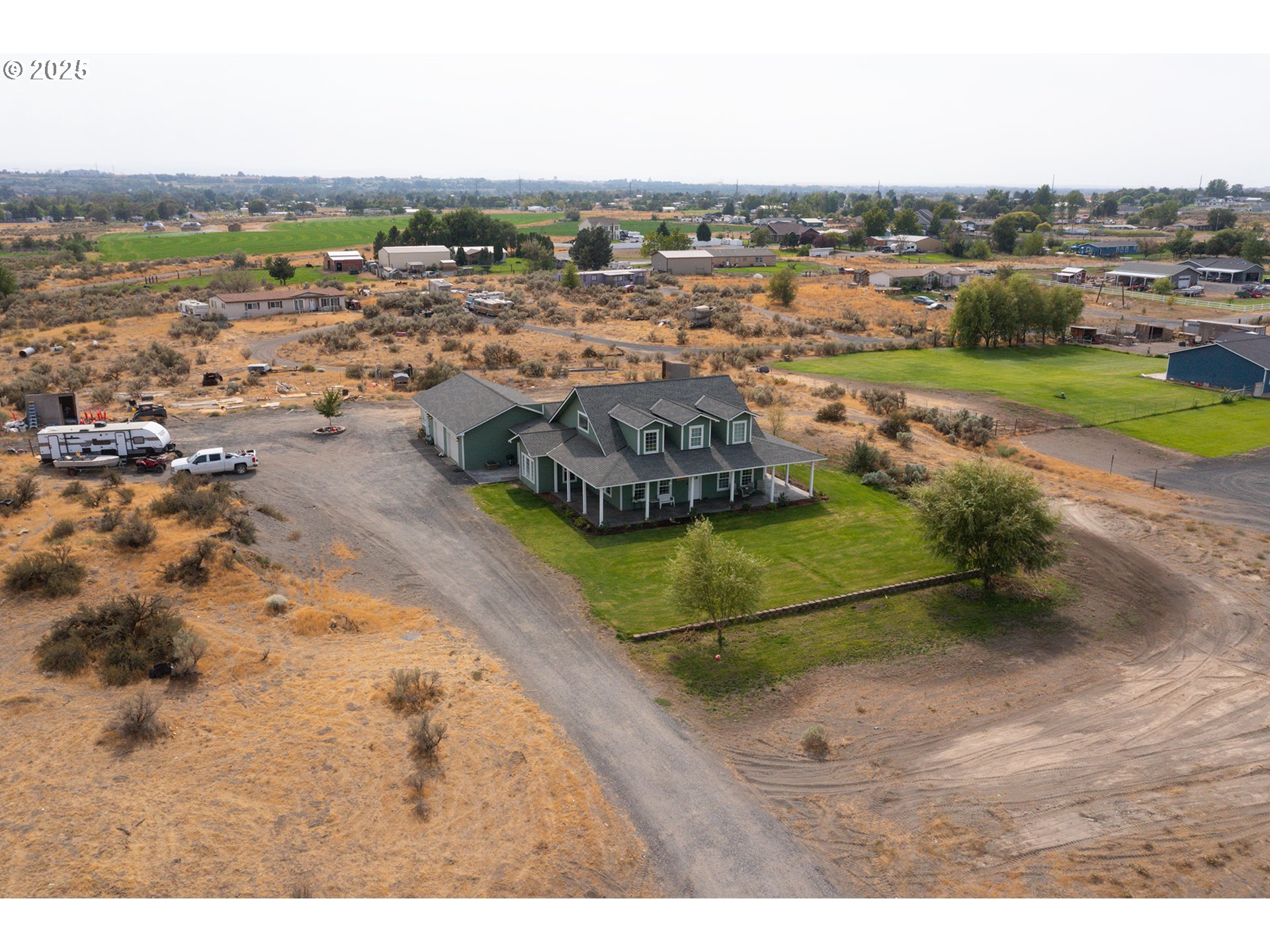31946 Sun Rdg Lane Hermiston, OR 97838 - Photo 36 of 36 an aerial view of a house with a yard