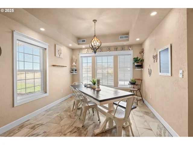 a view of a dining room with furniture window and outside view