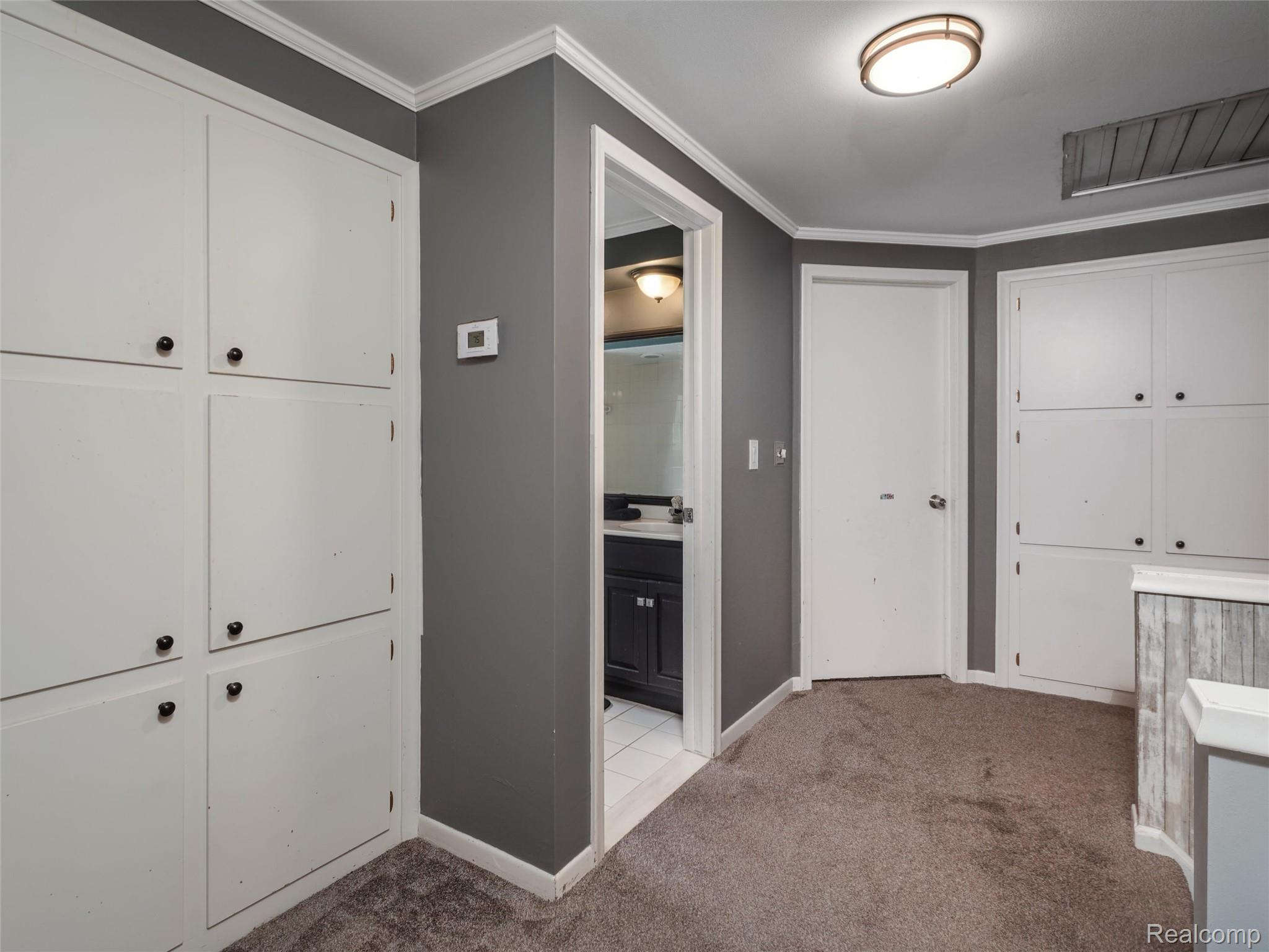 2143 Avoncrest Drive Rochester, MI 48309 - Photo 24 of 44 2nd floor hallway with builtin cabinetry for storage