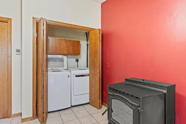a kitchen with a refrigerator and cabinets