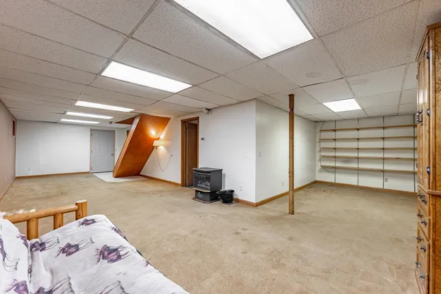 a view of an empty room with a fireplace