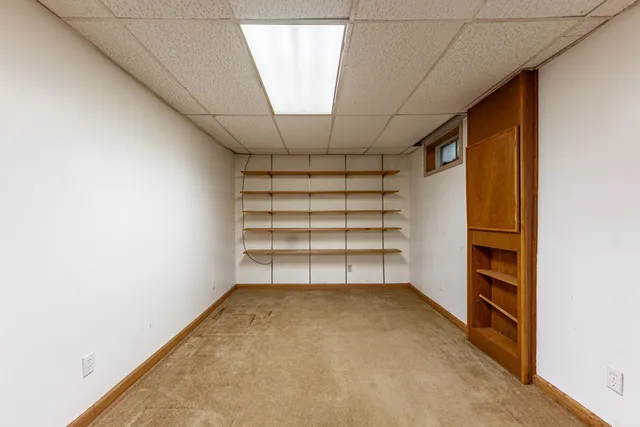 a view of room that has a large window