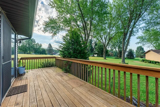 a balcony with trees in front of it