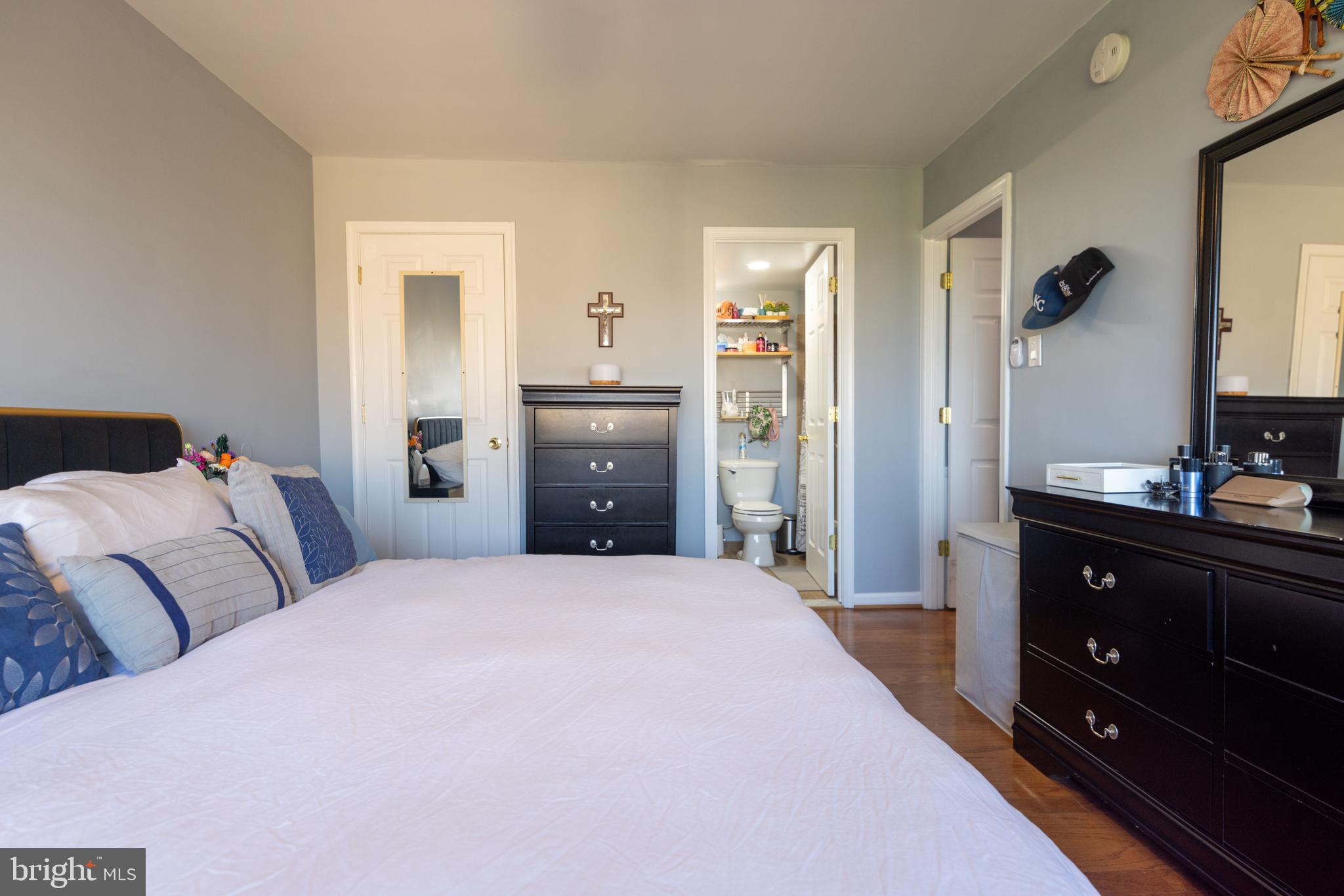 8830 Piney Branch Road, Unit 1207 Silver Spring, MD 20903 - Photo 21 of 38 a bedroom with a bed and a dresser