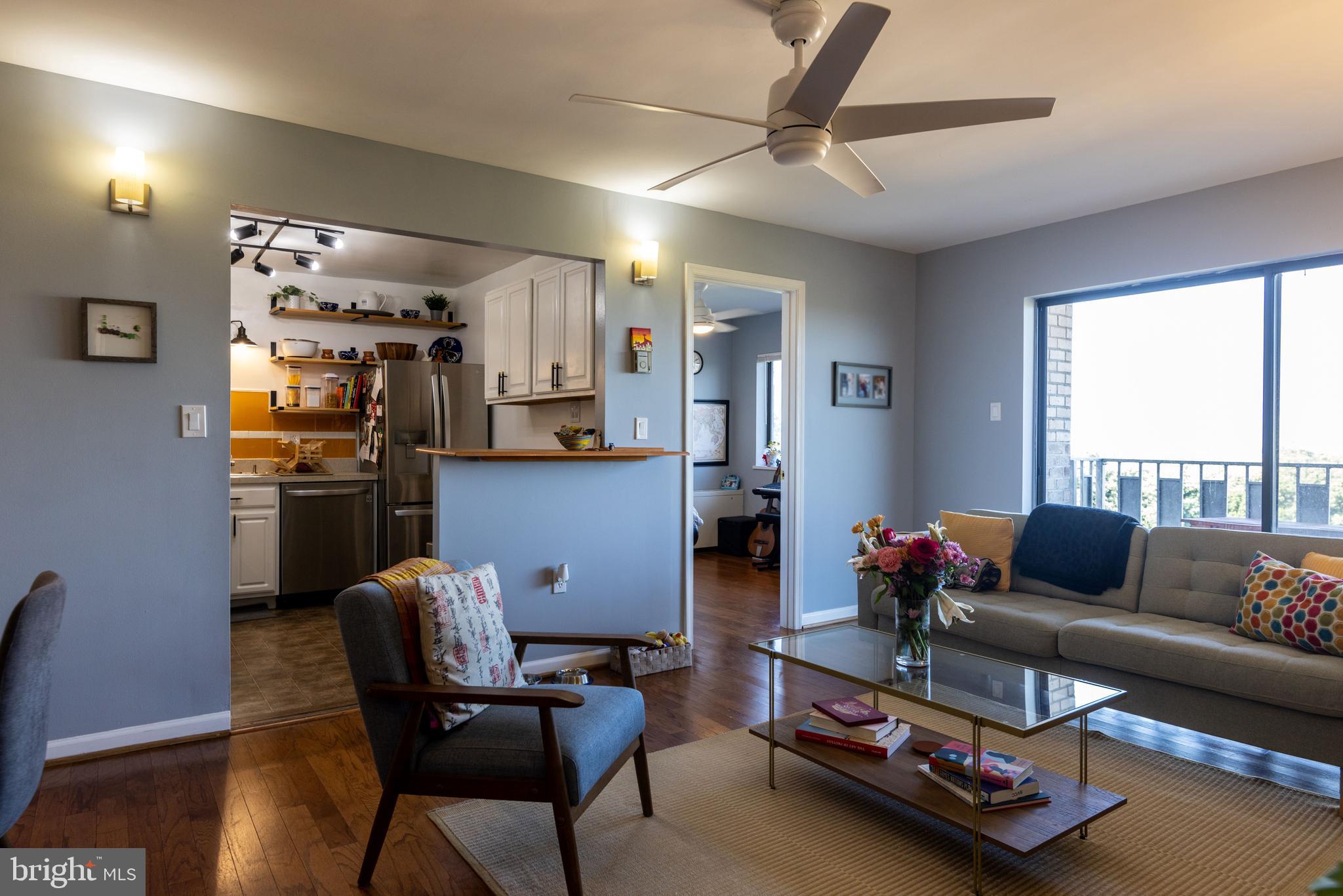 8830 Piney Branch Road, Unit 1207 Silver Spring, MD 20903 - Photo 26 of 38 a living room with furniture and a window