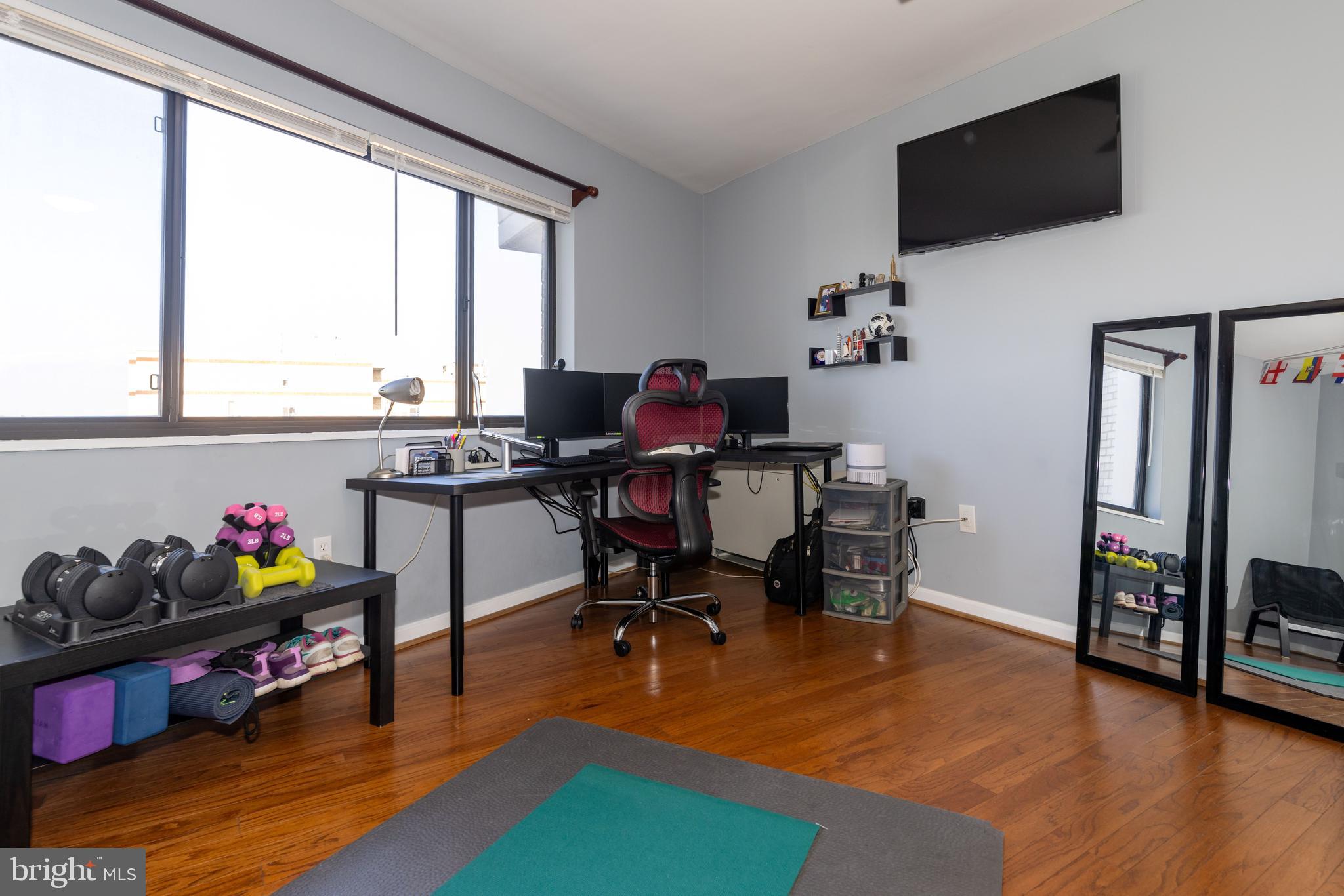 8830 Piney Branch Road, Unit 1207 Silver Spring, MD 20903 - Photo 35 of 38 a view of a workspace with furniture and a window