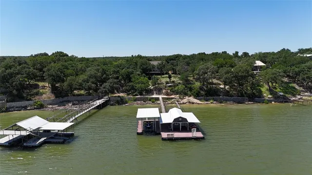 a view of a living room with furniture and wooden floor