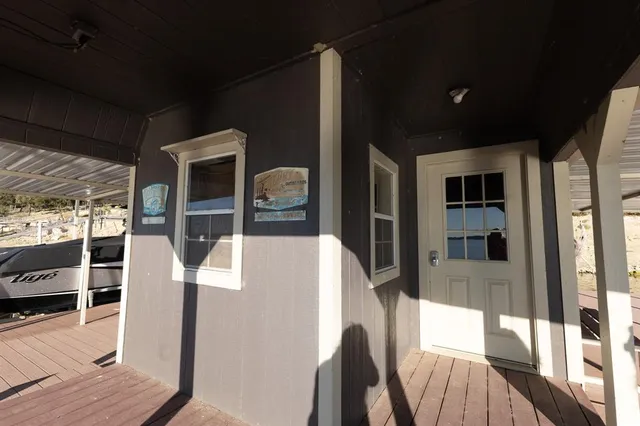 a view of a chairs and table in the balcony
