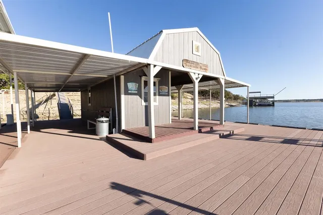 a view of a lake with houses in the back