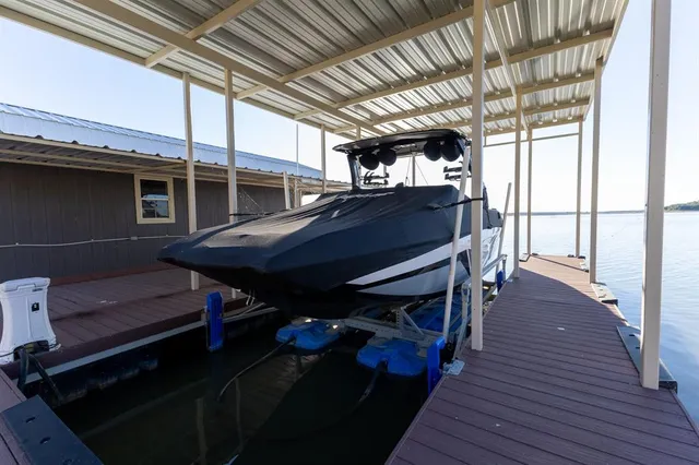 an aerial view of a houses with lake view