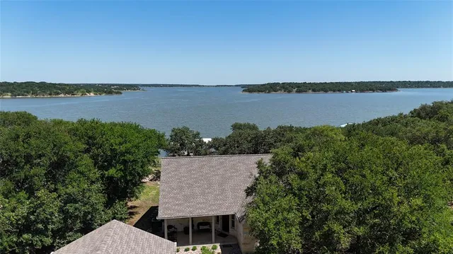 a view of a lake with a car parked