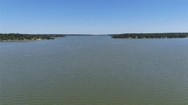 a view of a city with lush green forest