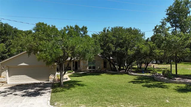 a view of a park with large trees