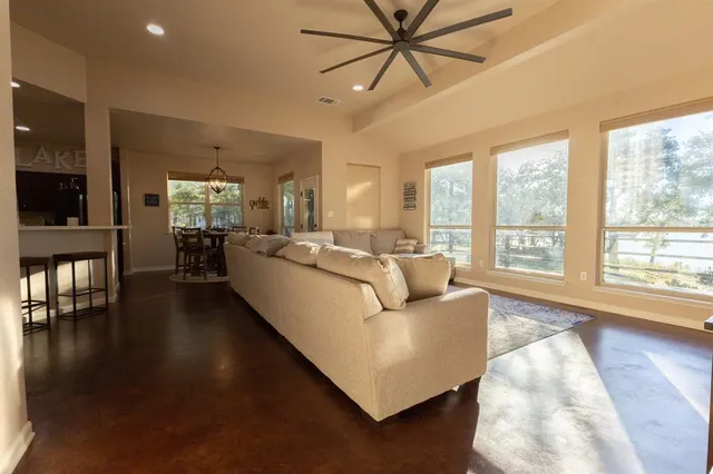 a living room with furniture and a large window