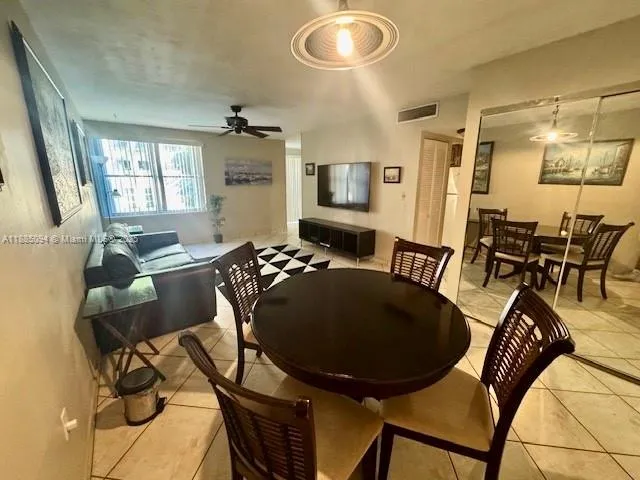 a kitchen with stainless steel appliances granite countertop a refrigerator sink and cabinets