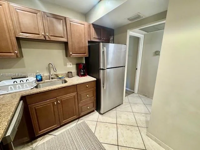 a kitchen with a sink stove and microwave
