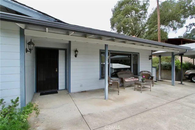 a view of the patio with chairs and tables
