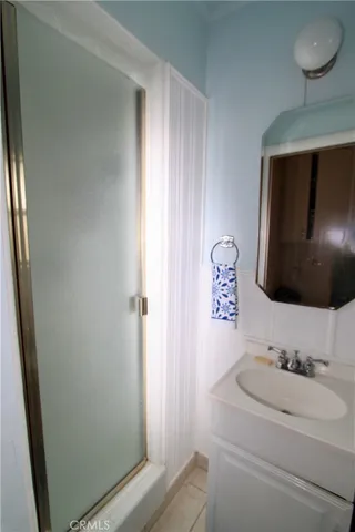 a kitchen with sink and cabinets