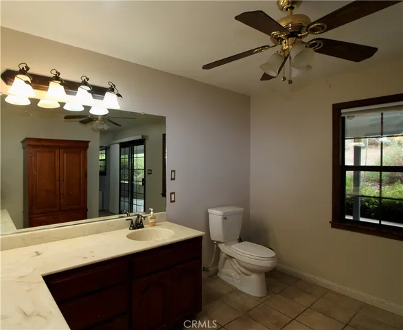 a blue bed sitting in a room next to a window