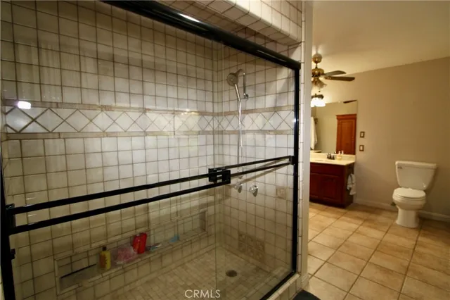 a bathroom with a glass door shower