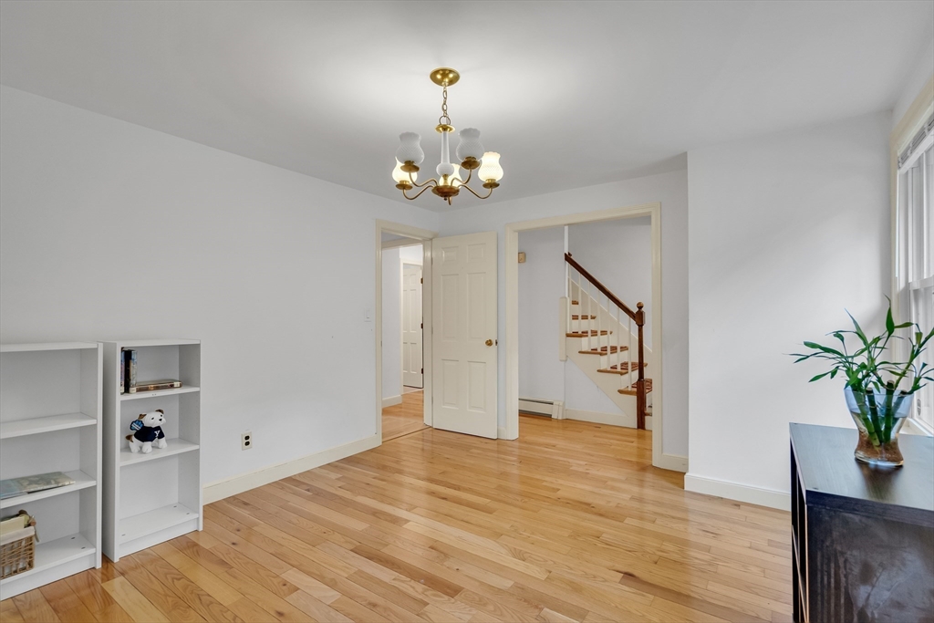 32 Dewey Road Lexington, MA 02420 - Photo 5 of 32 wooden floor in an empty room with a window